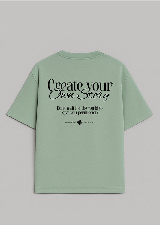Camiseta Oversize Pistacho - Create Your Own Story I New Citizen. Con lema estampado, corte para hombre, 100% algodón. Inspira acción, libertad personal y autenticidad. Empieza hoy a crear la vida que sueñas.